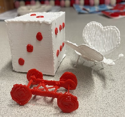 3D printed dice, butterfly, and cart 