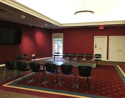 Dunning Meeting Room with tables, chairs and screen