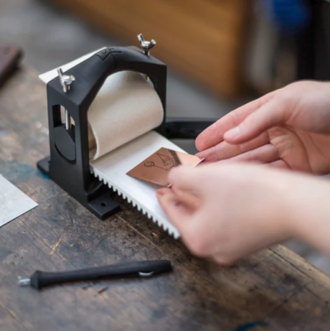 Hands loading an OpenPress tiny press