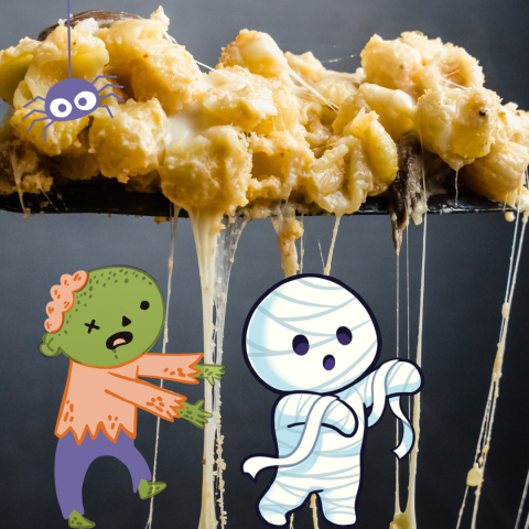 cheesy gooey macaroni and cheese accompanied by a zombie, mummy and spider