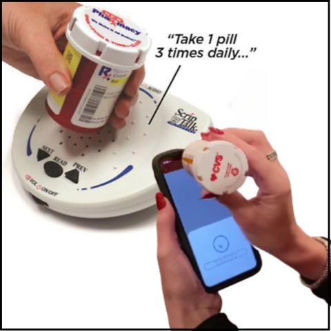 two hands holding prescription bottles - one to a smart phone and one to an audio reader device