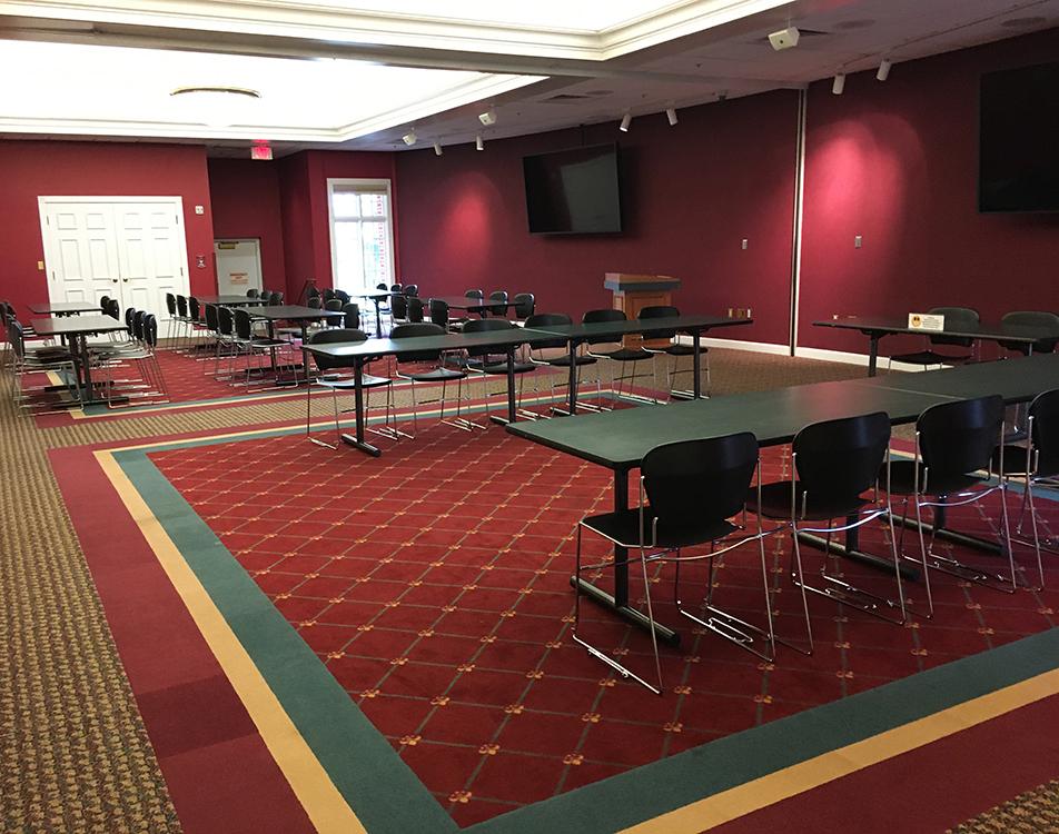 Walldorf/Dunning Meeting Room with tables, chairs and screens