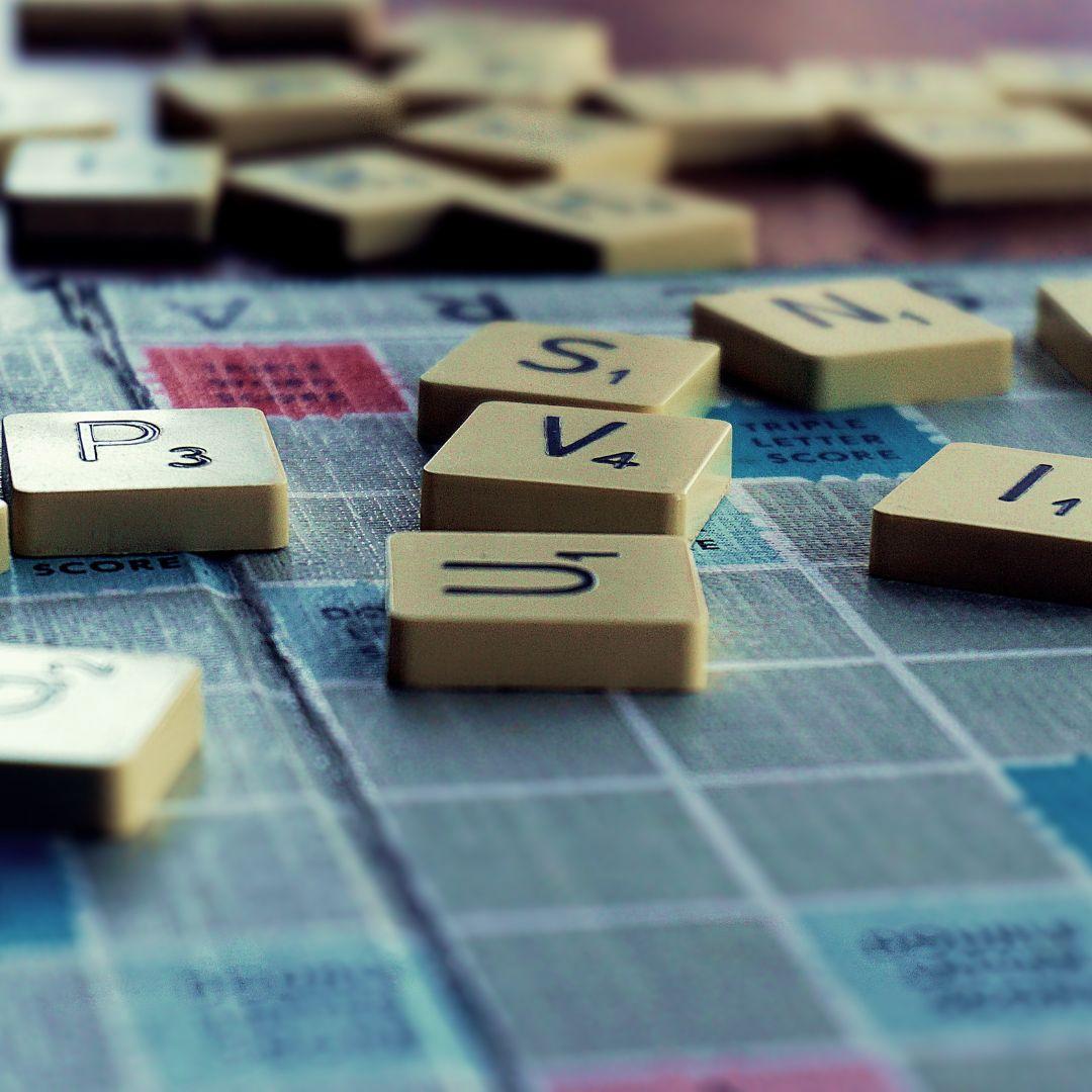 Scrabble games tiles on a Scrabble board