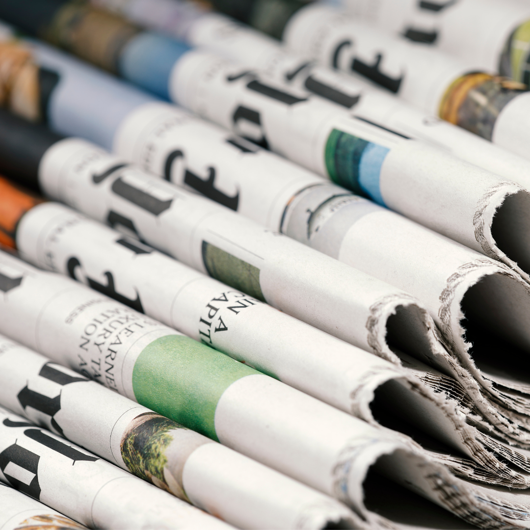 Pile of folded newspapers