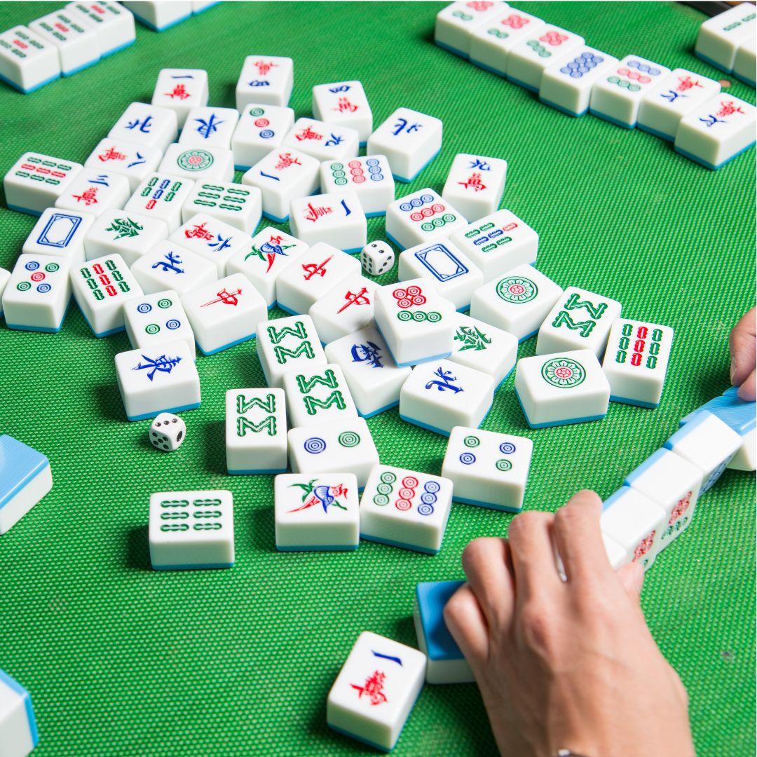 mahjong tiles on a green table