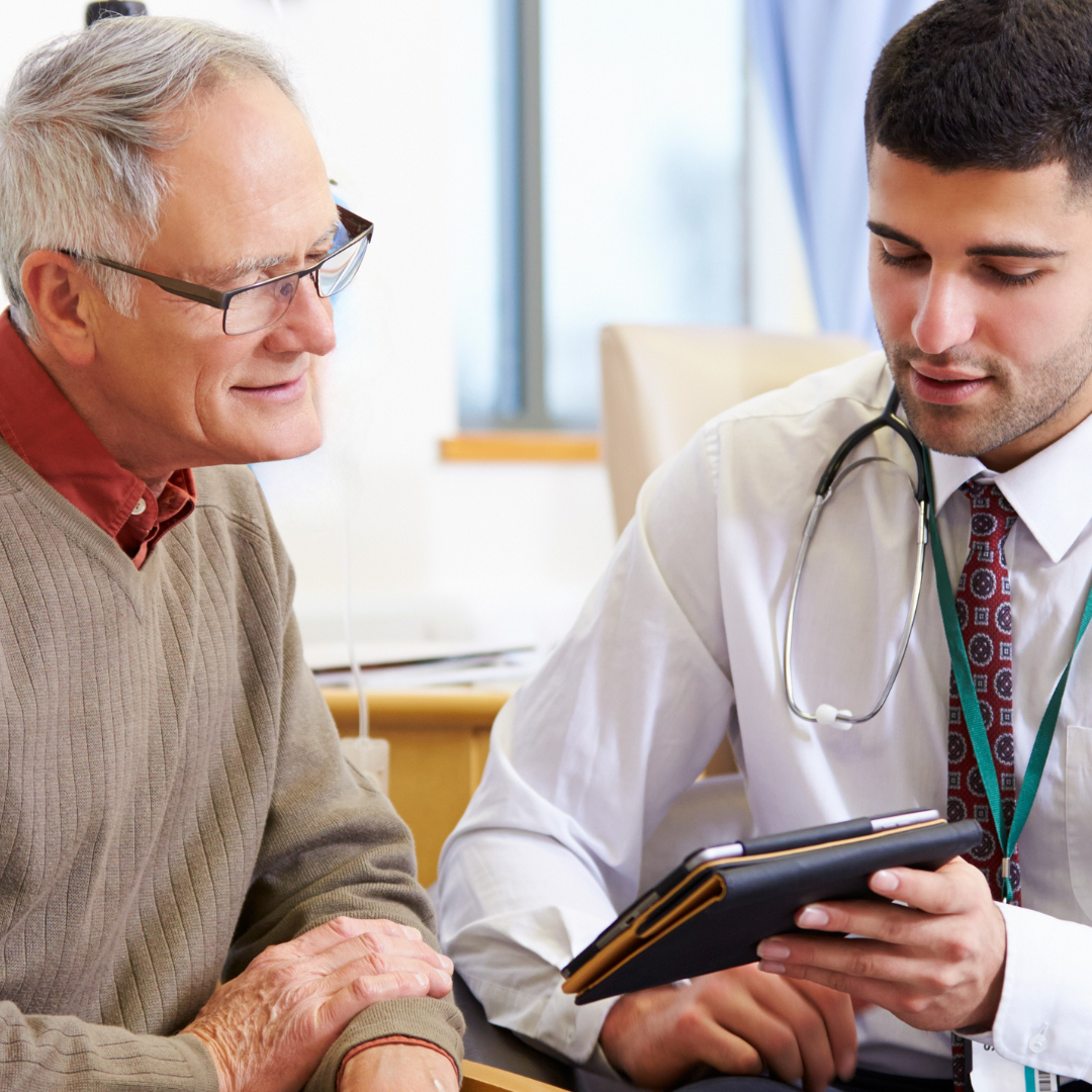 senior patient speaks to doctor